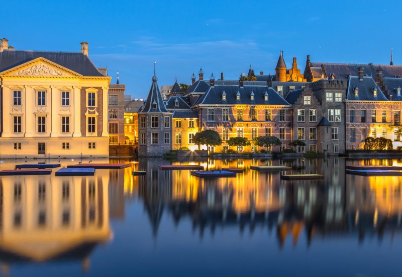 Dutch parliament building Binnenhof seen from Hofvijver at night